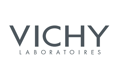 Das Bild zeigt das Logo von Vichy Laboratoires. Das Logo zeigt das Wort „VICHY“ in großen, grauen Großbuchstaben. Darunter steht „LABORATOIRES“ in kleineren, grauen Großbuchstaben. Der Text ist auf einem weißen Hintergrund zentriert.